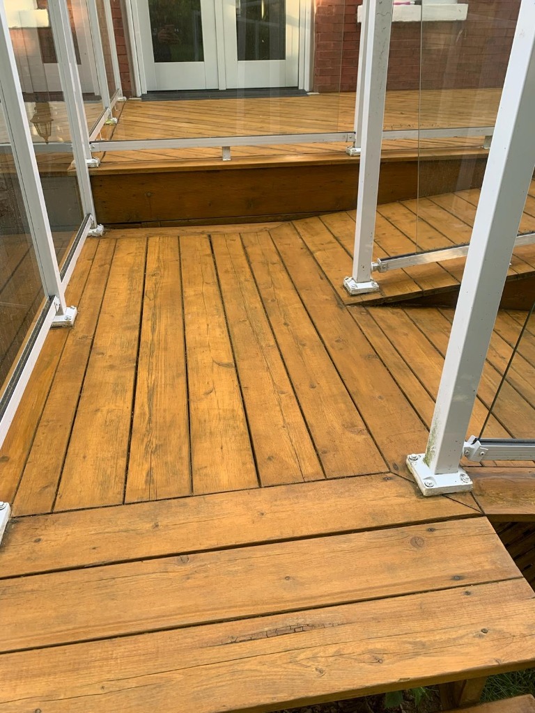 Fully restored and stained deck in London Ontario after professional deck restoration by Core Exteriors