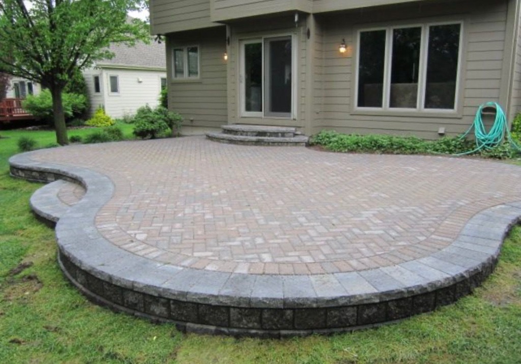 Restored natural stone patio in Komoka Ontario after professional cleaning and sealing by Core Exteriors